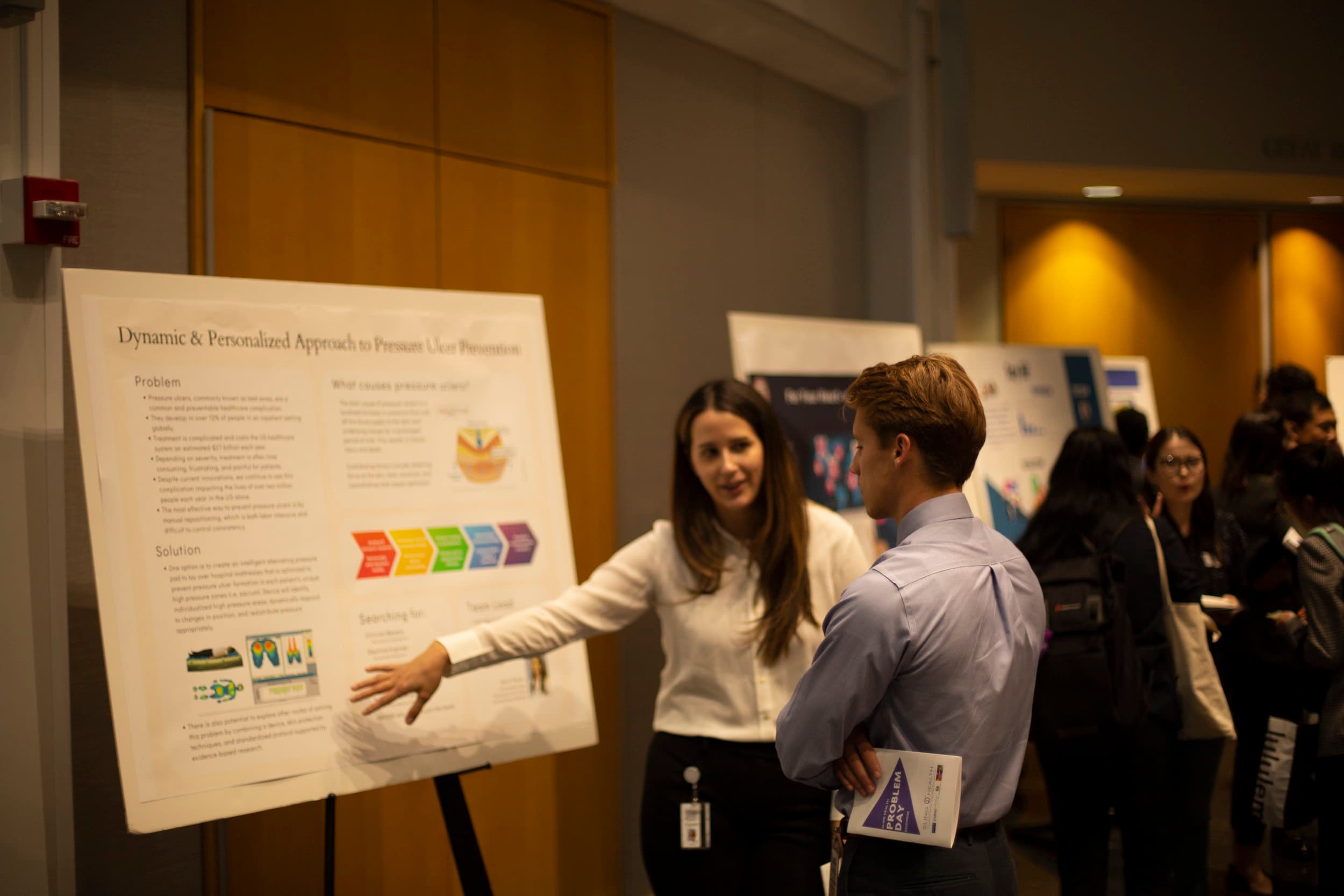 Students and clinicians at a poster session